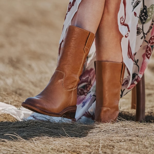 Featuring the Tabitha mid calf boot in brown.