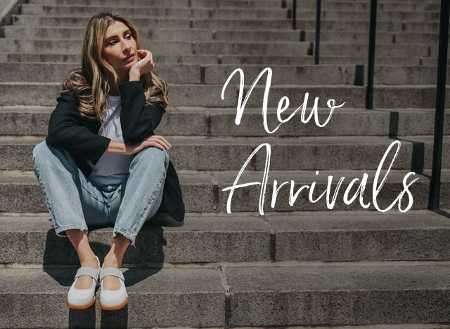 New Arrivals. A woman sitting on steps wearing the Kelly mary jane sneaker in white. Shop the Kelly.